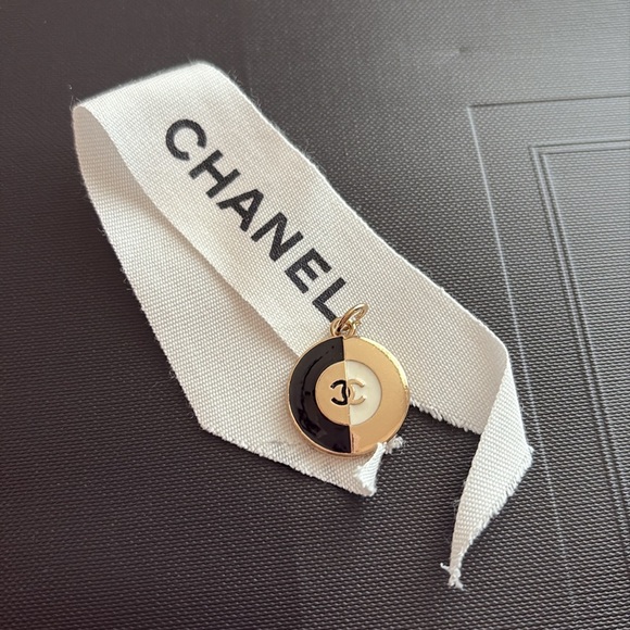 Chanel Black and Gold Stamped Pendant in a ribbon - Picture 1 of 2